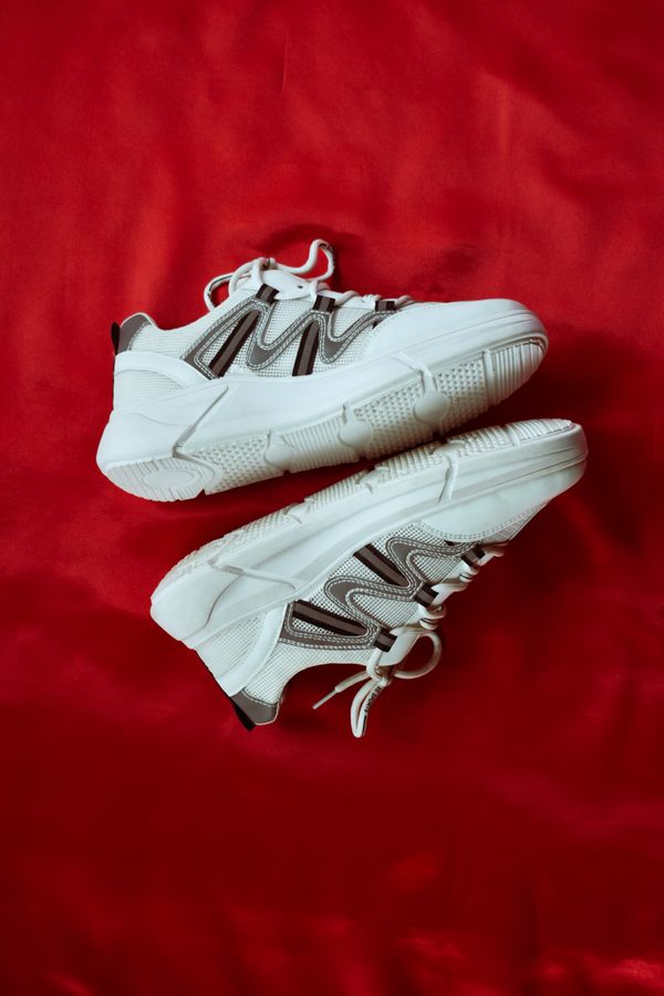 A pair of white chunky trainers